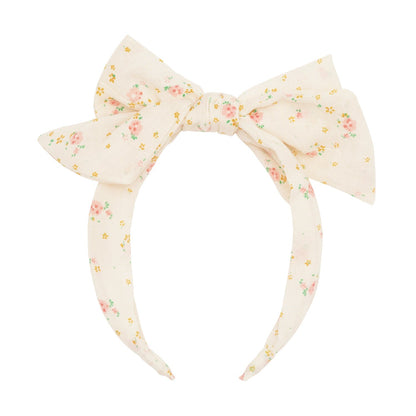 Cerchietto a fascia Rockahula con fiori rosa e fiocco centrale