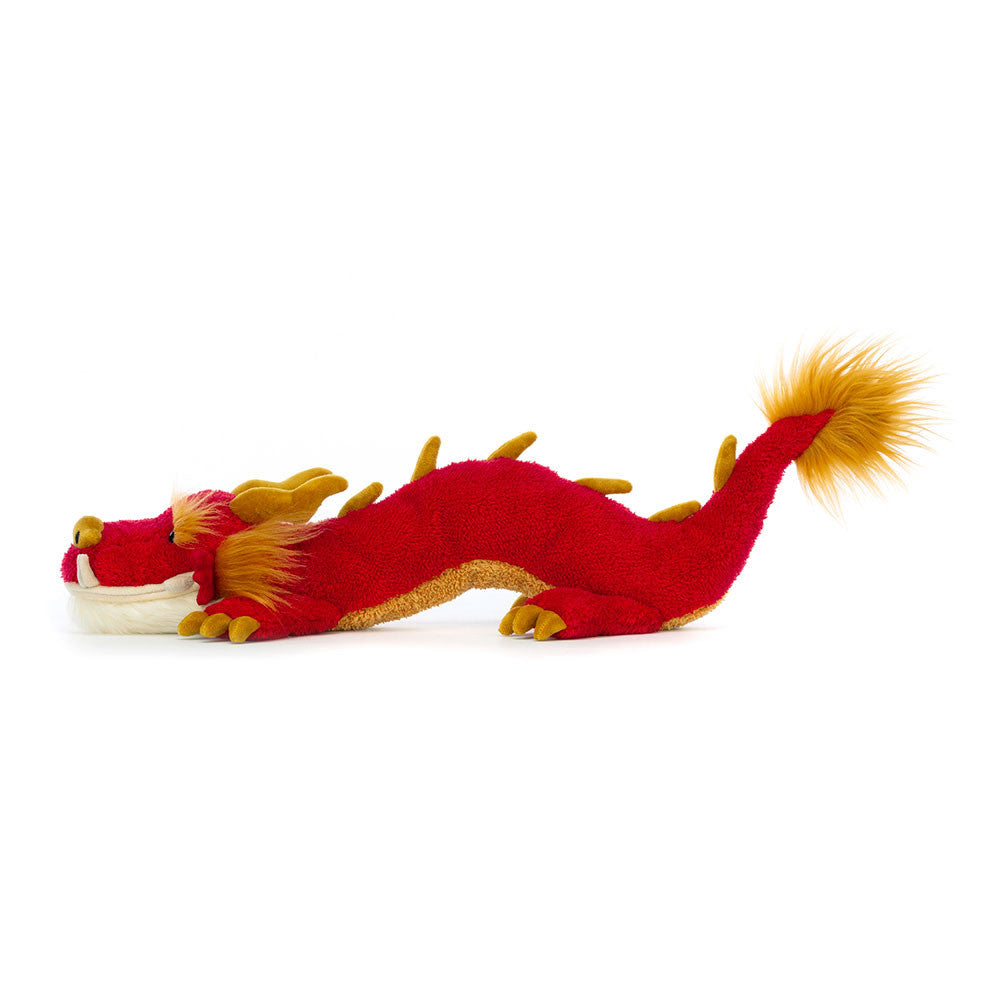 Vista laterale Jellycat Festival Dragon peluche drago rosso e oro con barba soffice