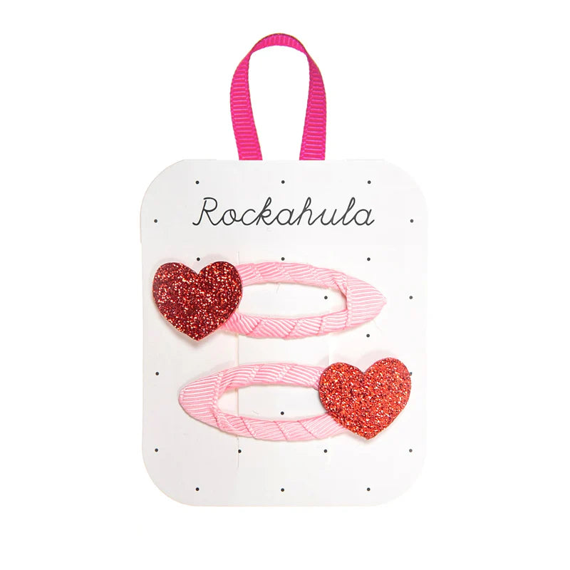 Mollette a cuore glitter rosso con nastro rosa per bambina set da due pezzi