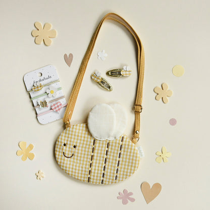 Mollette, elastici per  capelli e borsa Rockahula 